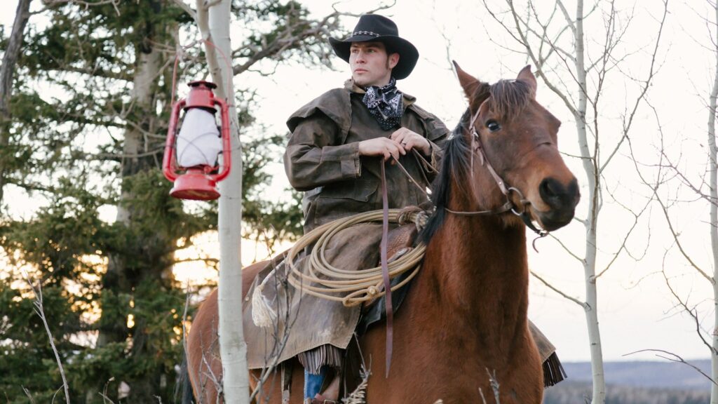 man riding on ranch horse