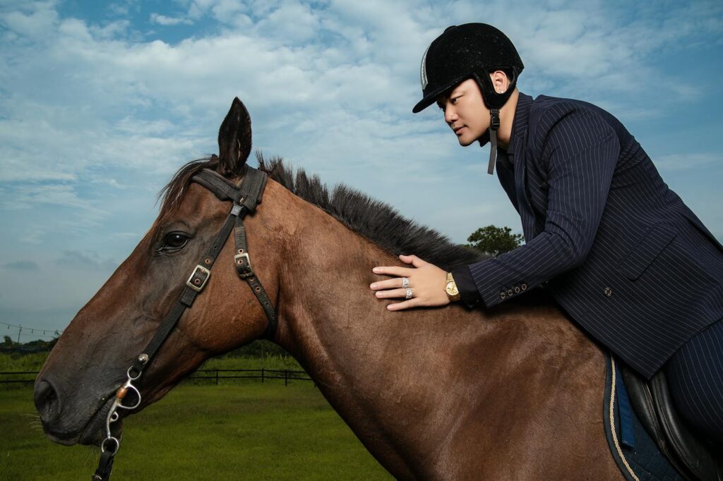 Rider in suit horseback riding