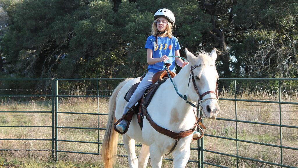 A woman on horseback ride