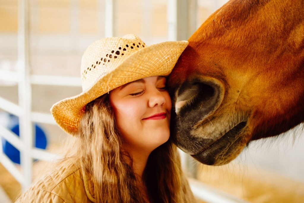 Woman's face next to horse