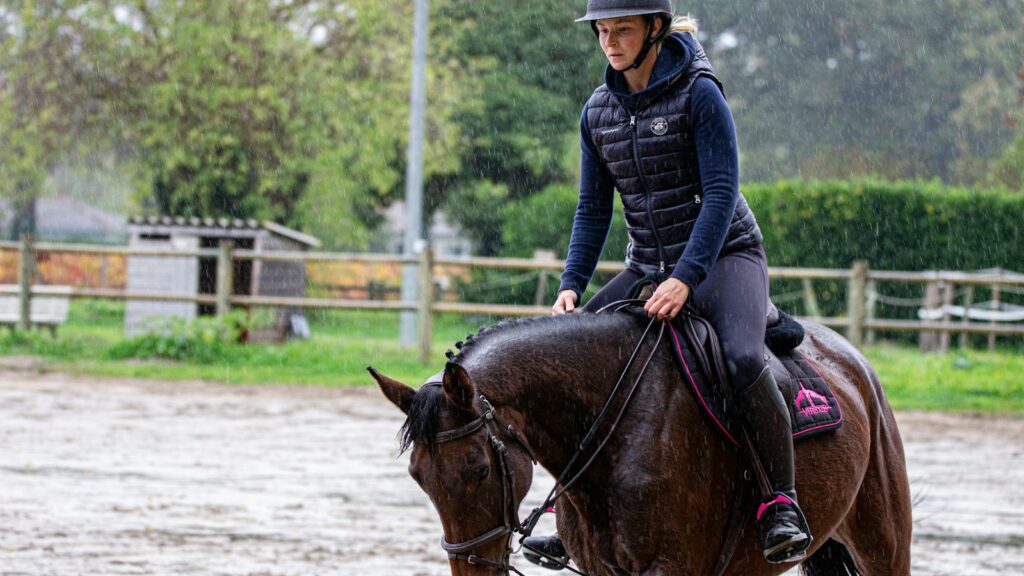 man riding horse during daytime