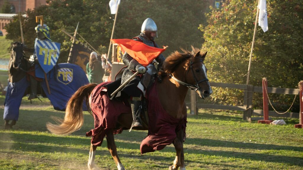 A man riding on the back of a brown horse