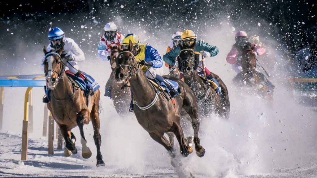 a group of men riding on the backs of horses