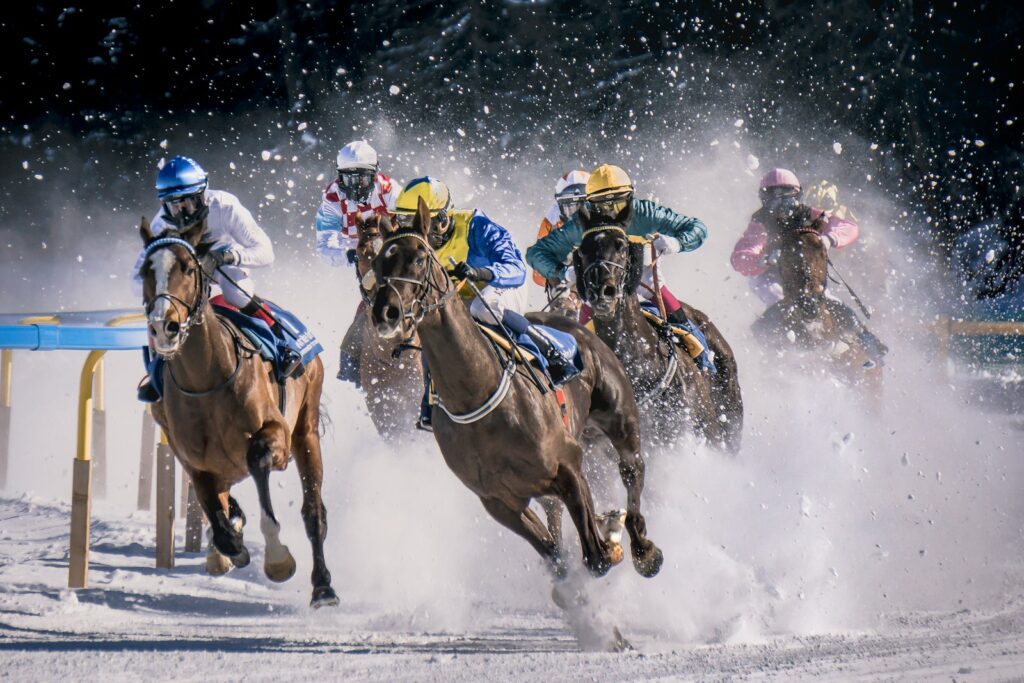 Agroup of men riding on the backs of horses