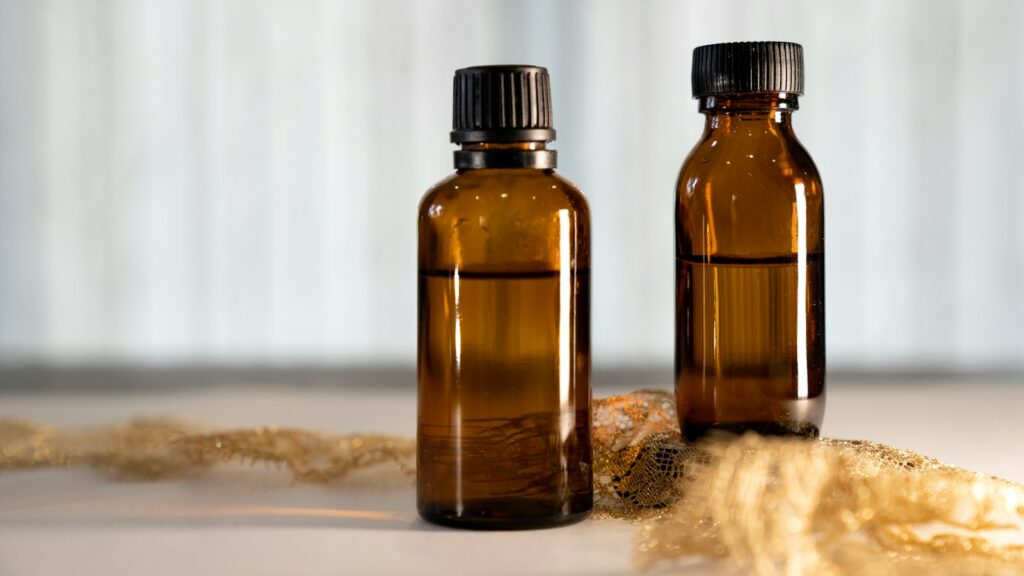 a couple of brown bottles sitting on top of a table