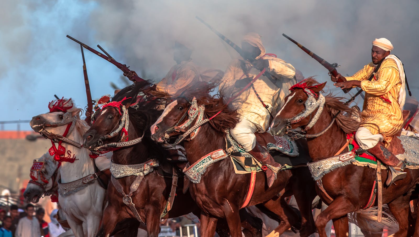 Algerian play riding horses and firing rifles