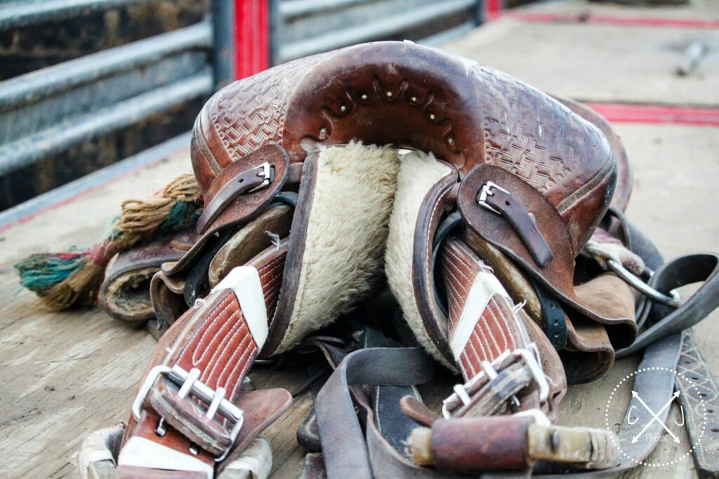 Brown leather horse saddle on top of trailer