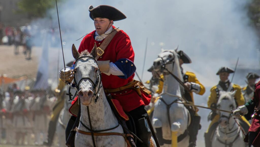 Dramatic cavalry charge during a historic military reenactment in Almansa, Spain.