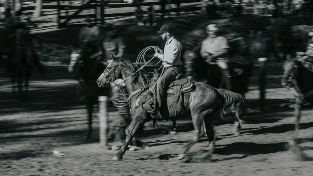 Rider in motion on horseback during a rodeo event in São Paulo, Brazil.