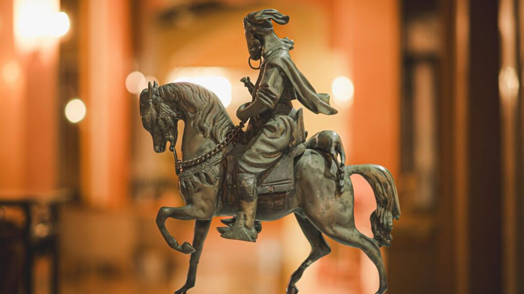 Elegant bronze horse statue captured indoors in Tabarka, Tunisia.