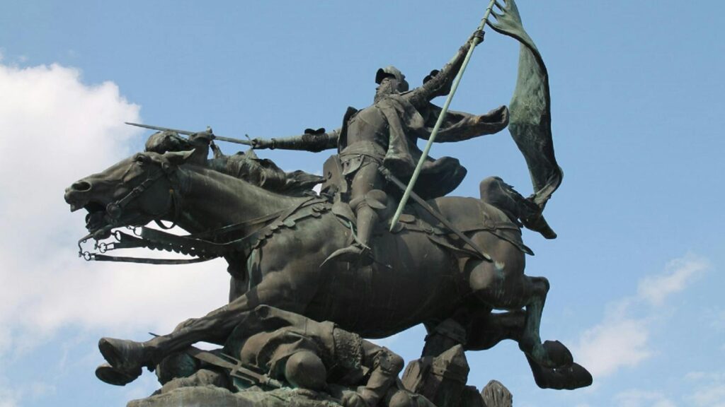 Bronze equestrian statue against the sky in Chinon, France.