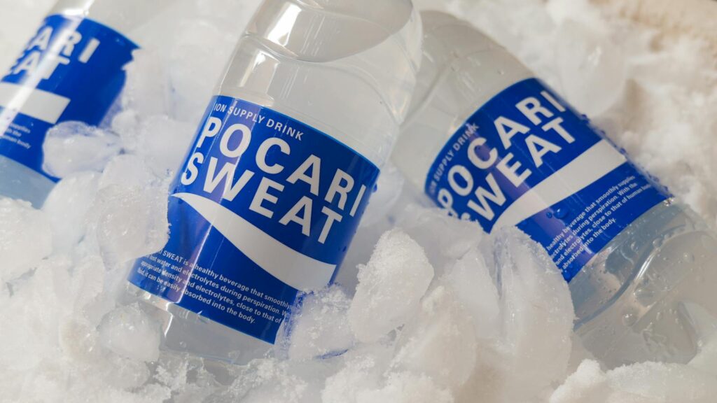 Chilled Pocari Sweat bottles resting in ice, showcasing hydration and refreshment.