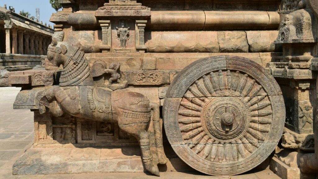 Intricate stone chariot sculpture at a historic temple in Kumbakonam, Tamil Nadu.