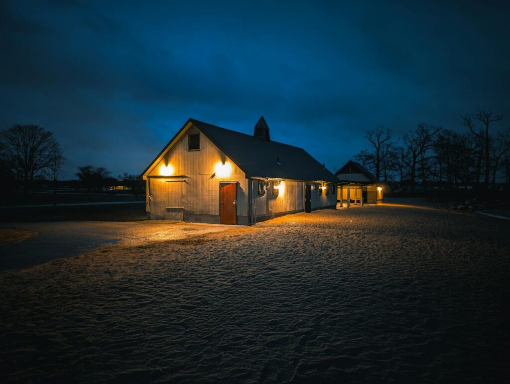 Solitary barn glows warmly in the twilight