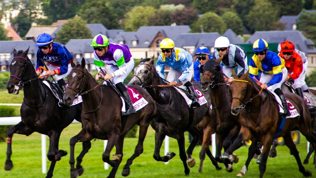 group of people riding horses