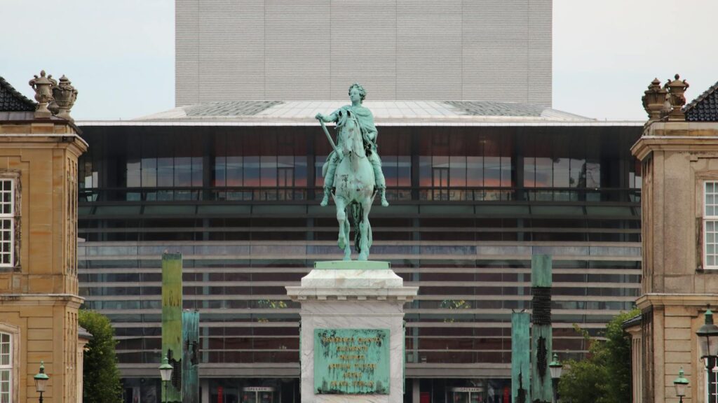 Statue of Frederic V with Copenhagen Opera House in the background, Denmark.