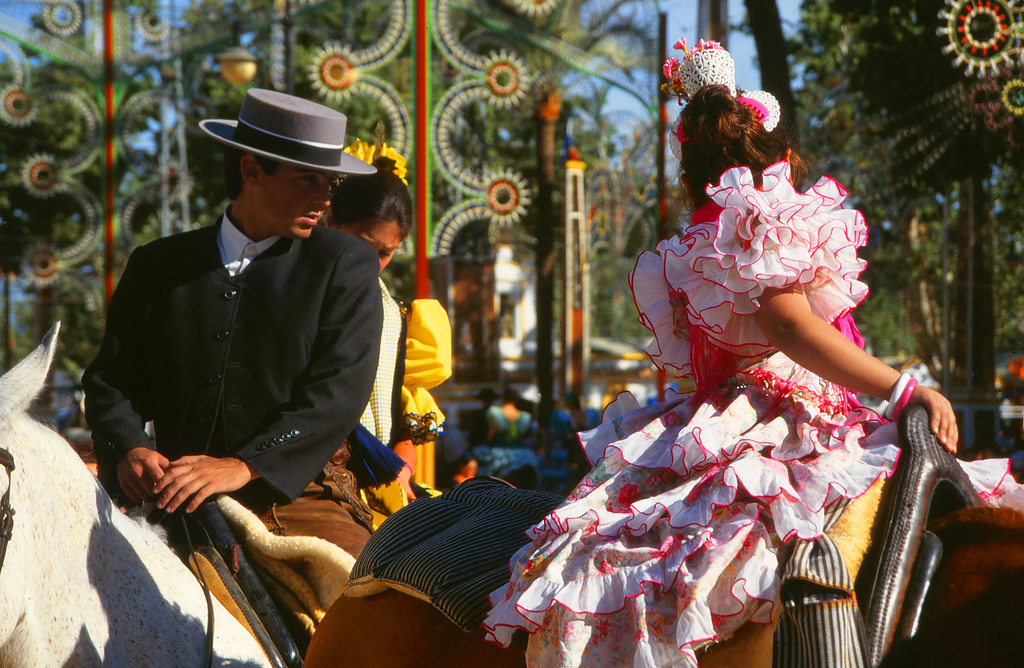 two horses with the riders on back