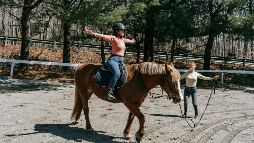 Woman practices riding techniques in a park setting, emphasizing balance and skill development.