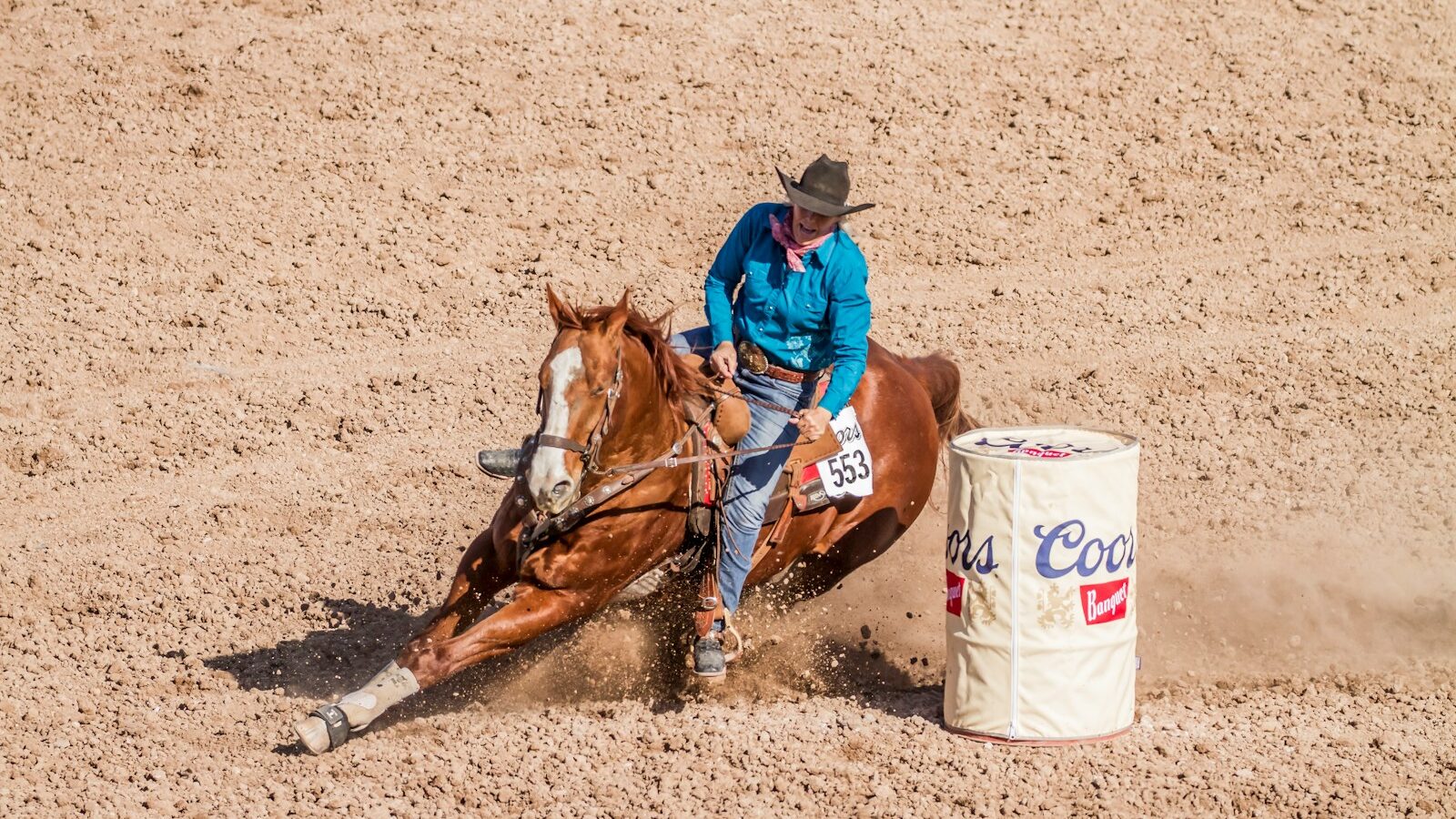 man riding on brown horse running on brown field