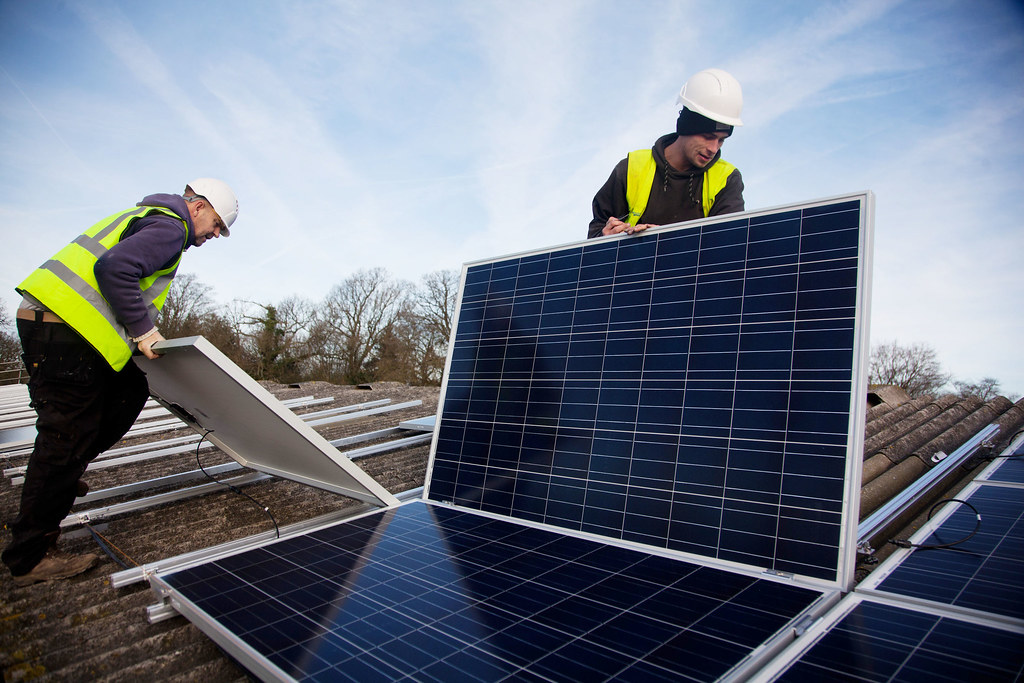 Solar panels installation on the roof of the barn