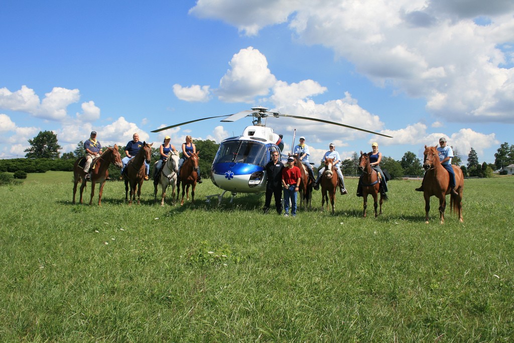 Members of Buffalo Trace Mounted Patrol SAR with air ambulance helicopter during a training session.