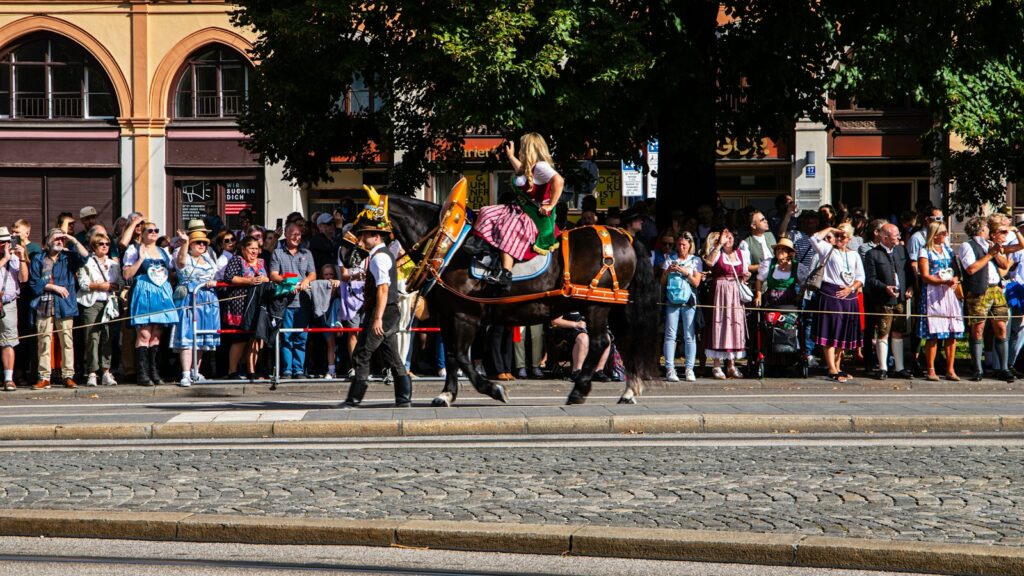 a man riding on the back of a black horse