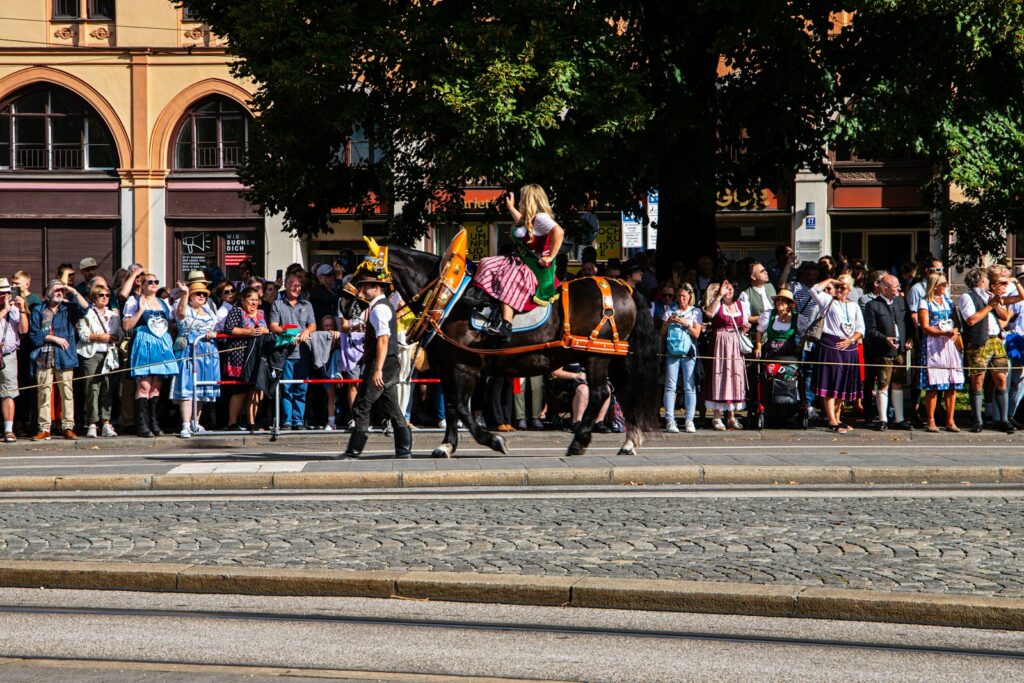 A man riding on the back of a black horse