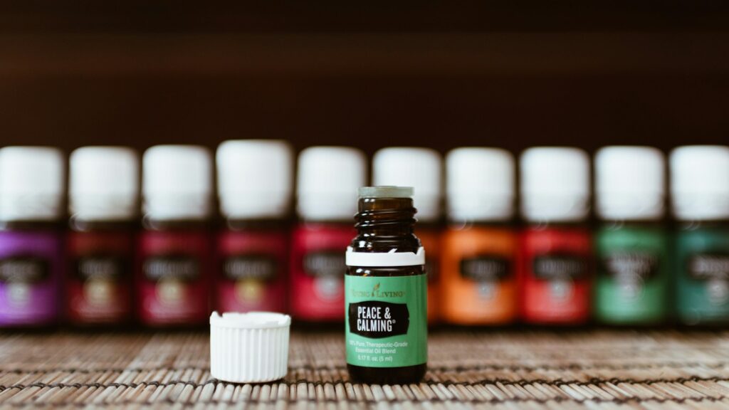 brown glass bottle on top of beige wooden surfac