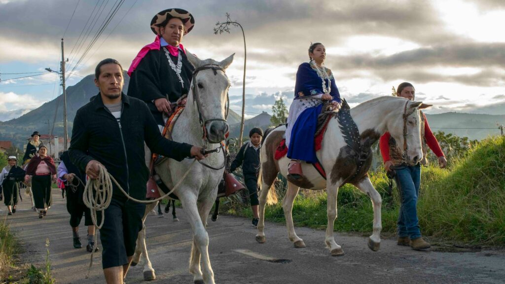 a group of people riding horses