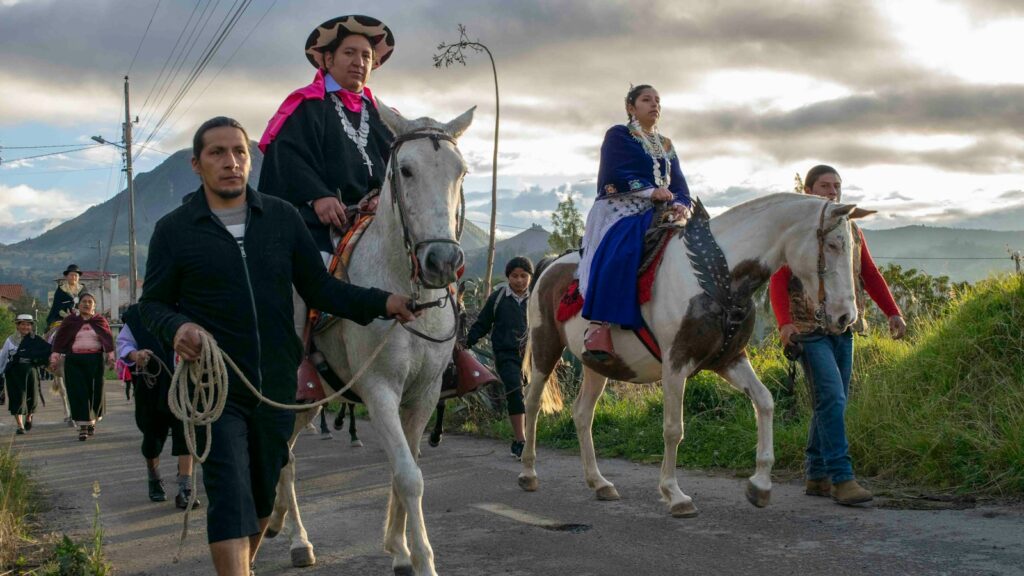 a group of people riding horses
