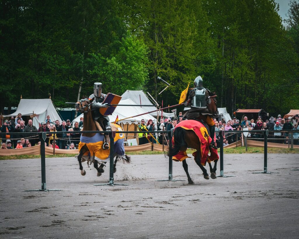 Two men jousting during daytime