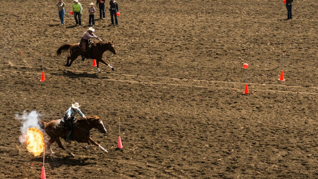 two men racing horseback riding