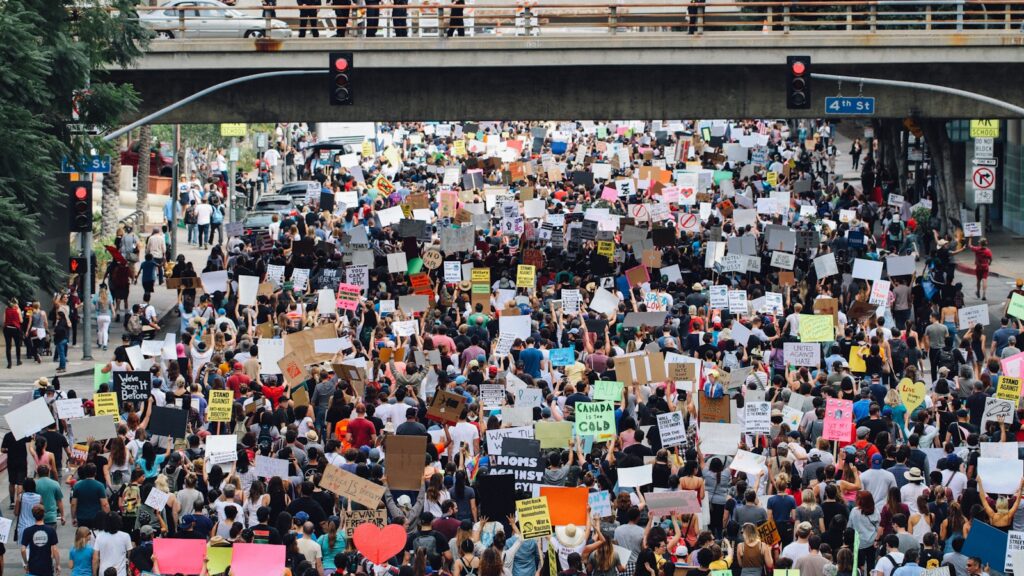 a large group of people holding up signs