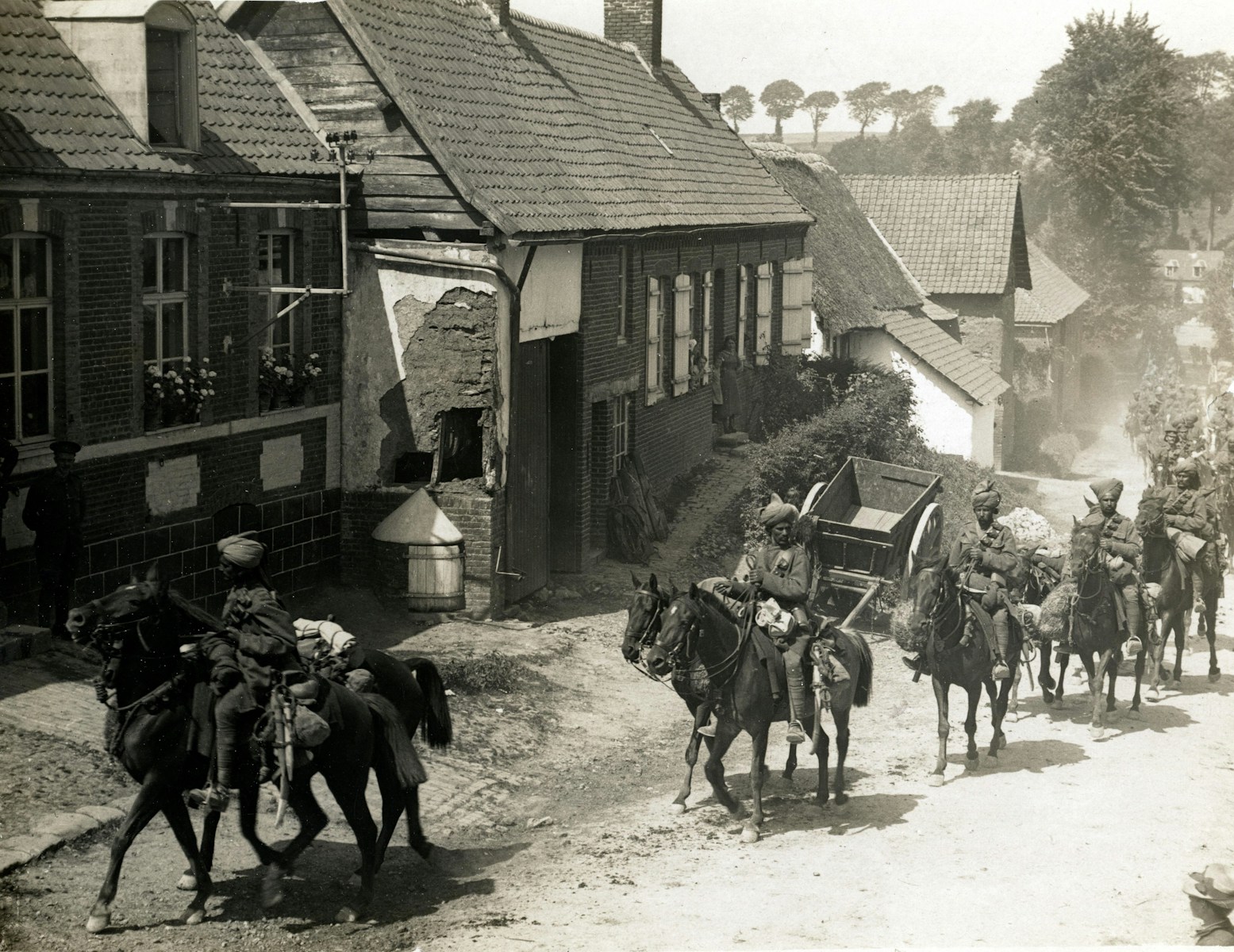 1914, World War 1. Indian cavalry marching through a French village.