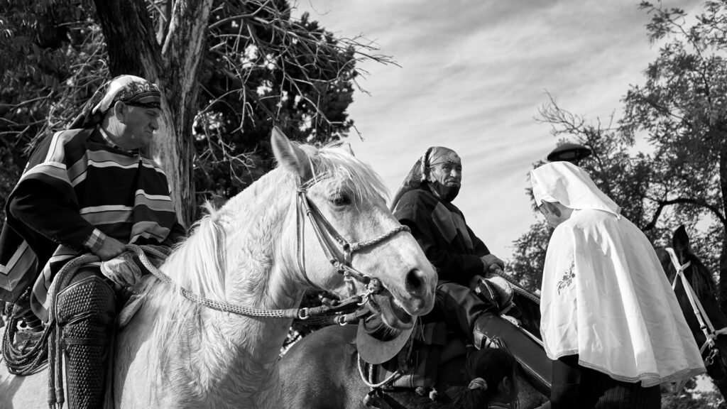 a group of people riding horses