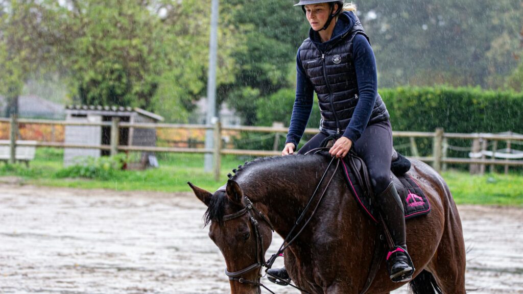 man riding horse during daytime