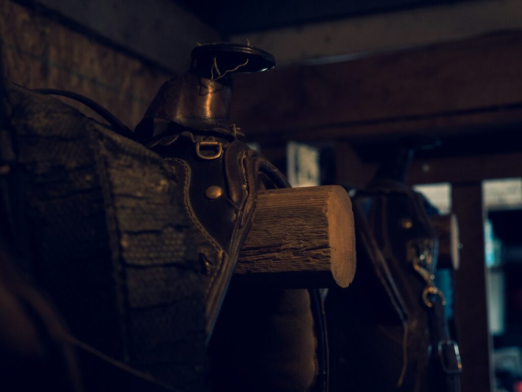 Brown wooden handle on black leather textile