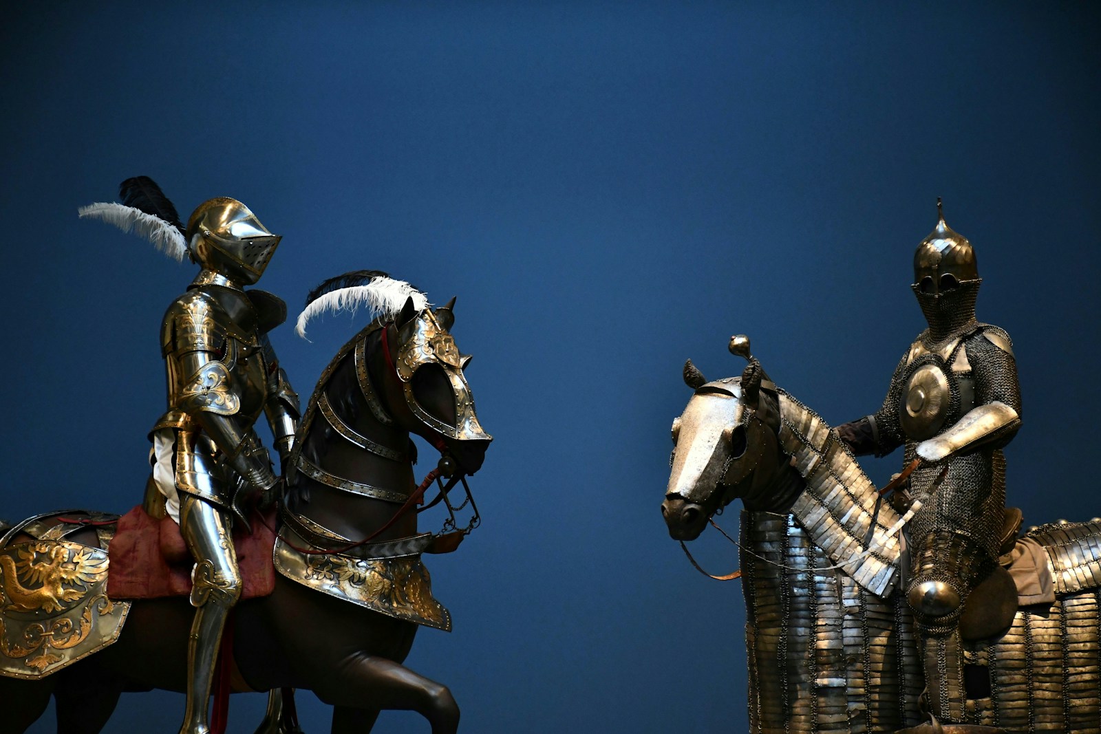 A group of statues of men on horses