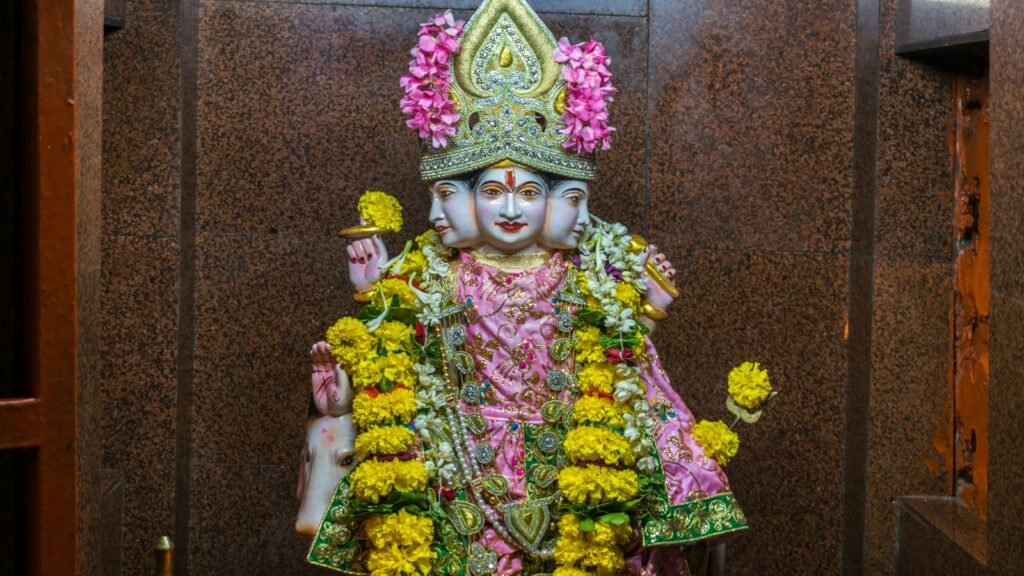 a statue of a hindu god in a temple