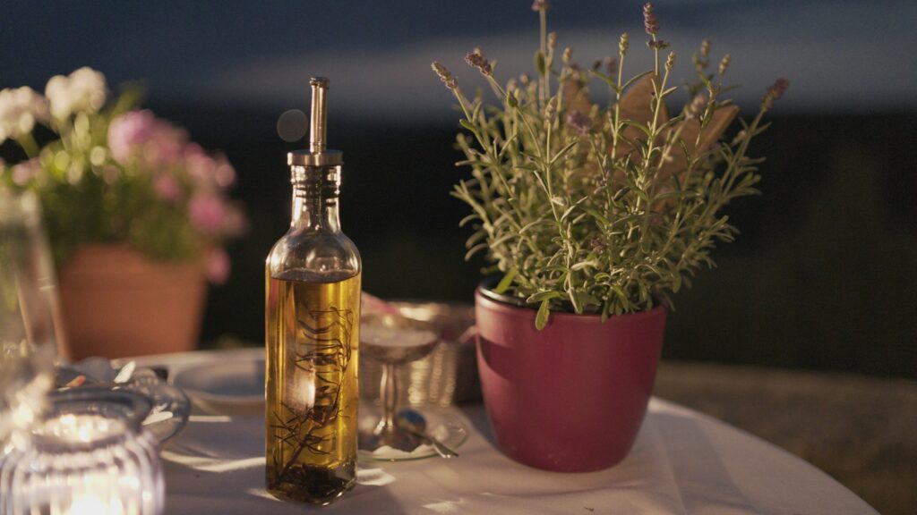 clear glass bottle beside plant