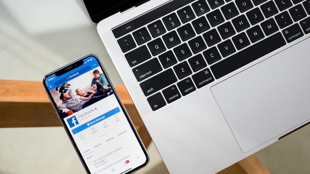 iPhone X beside MacBook