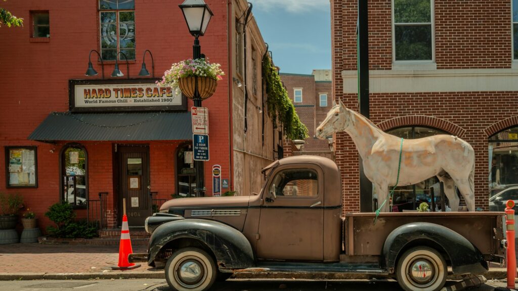 a horse is standing on the back of a truck