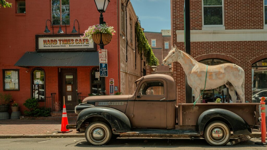 a horse is standing on the back of a truck
