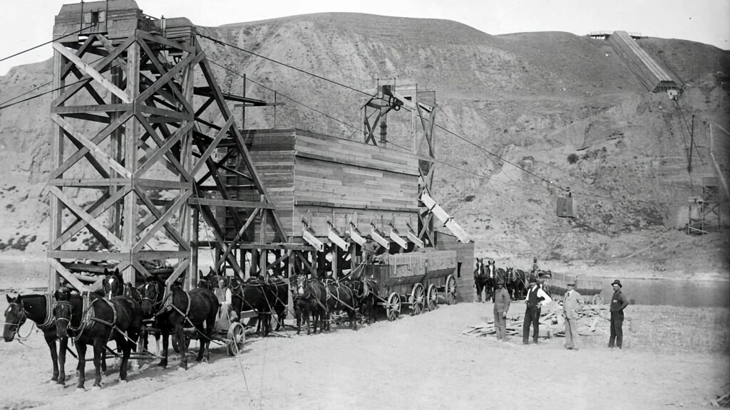 a group of men standing next to a wooden structure