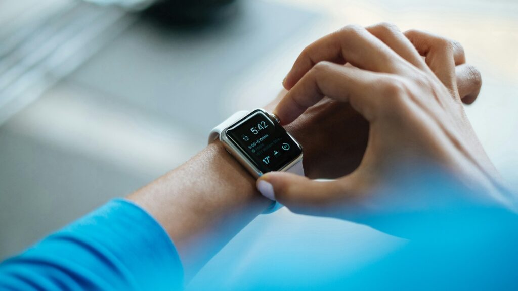 person clicking Apple Watch smartwatch