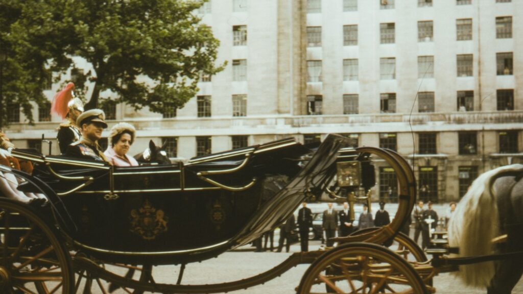 people riding on black wooden carriage during daytime