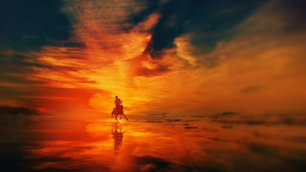 silhouette of man riding a horse