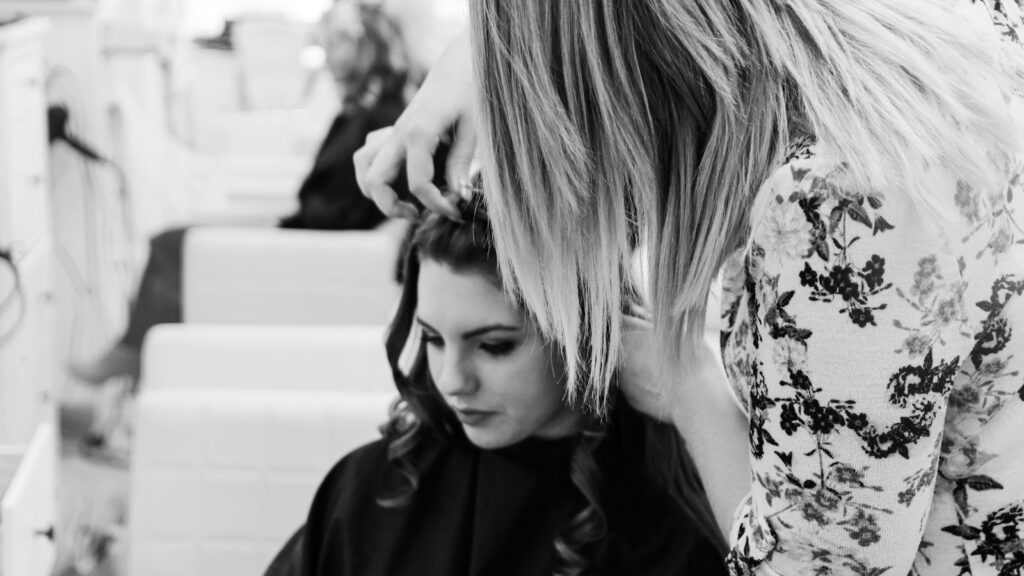 woman getting her hair done inside salon