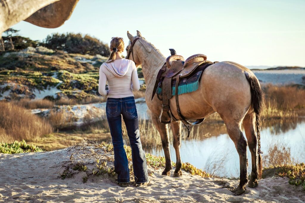 Woman with sadded horse