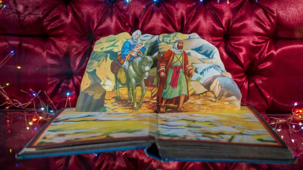 man in yellow and red robe painting